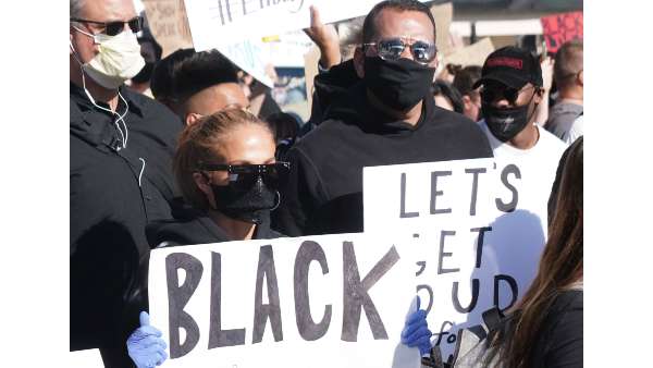 JLo And Alex Holding BLM Signs At The March