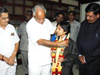 B S Yediyurappa honouring Master Kishan B S Yediyurappa honouring Master Kishan
