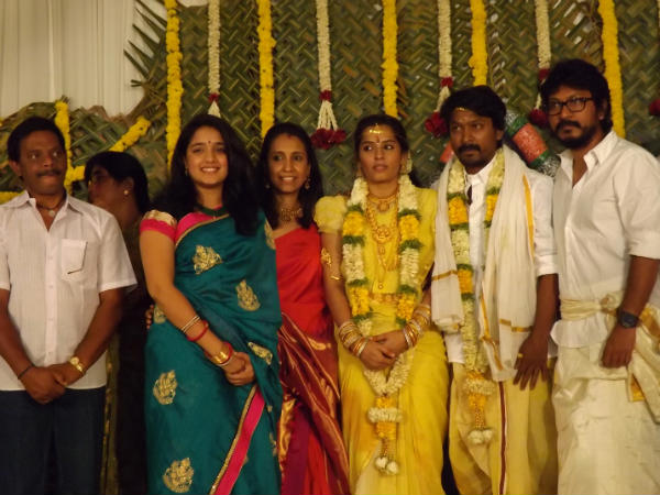 The Newly Married Couple Pose For The Camera