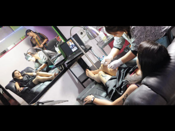 Stylist Designing The Tattoo