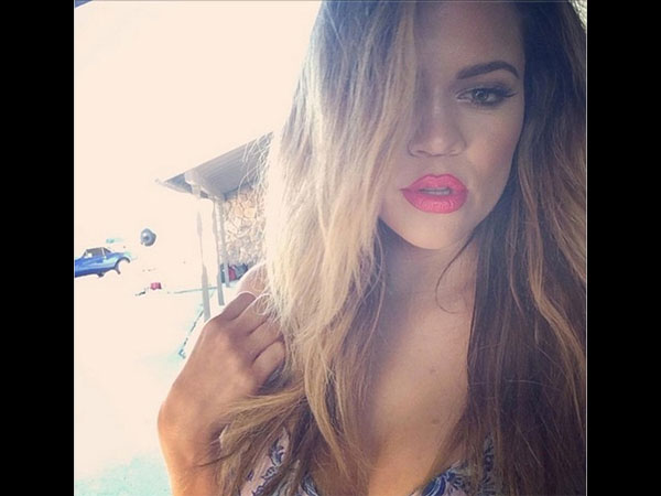Khloe Kardashian slammed hater on Twitter for accusing her of editing a hot gym selfie. She ...