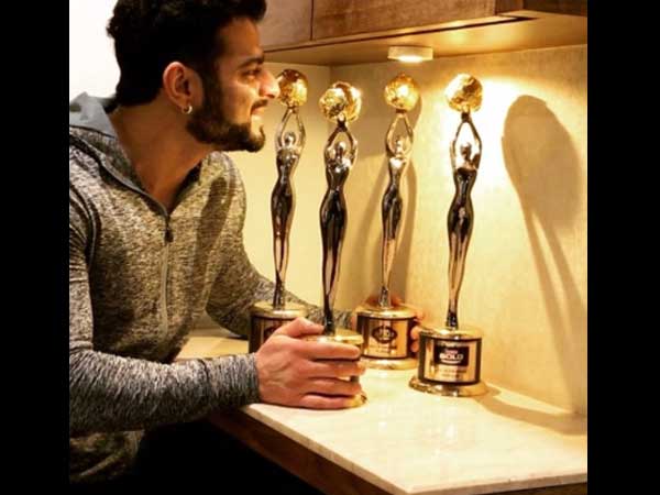 Karan With His Awards
