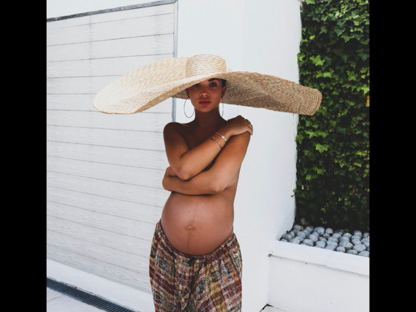 A Pregnant Amy Strikes A Confident Pose