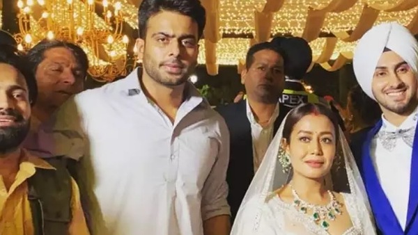 Neha & Rohan Pose With Guests